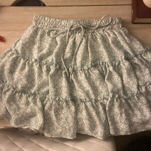 Altard state skirt. Light teal color with a floral design.